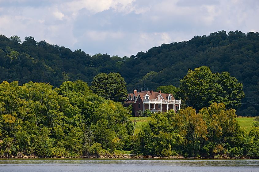 A beautiful old mansion can be seen from a boat on the French Board River in Newport, Tennessee