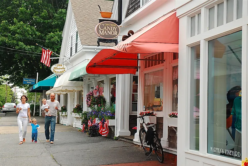  A young family walks through the charming Cape Cod town of Chatham, Massachusetts. Editorial credit: James Kirkikis / Shutterstock.com