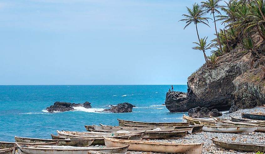 Fishing boats lined up on the beach of Sao Tome and Principe, an island nation in the Gulf of Guinea.