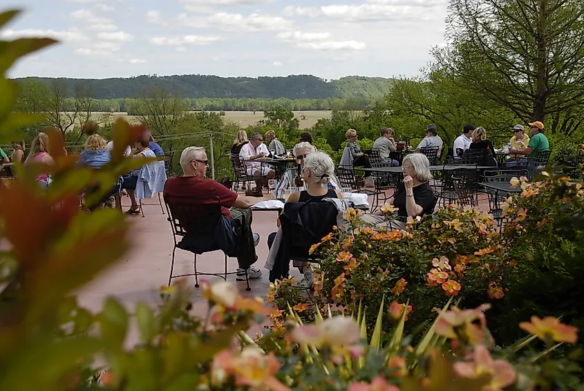 People enjoying wine at a winery in Defiance, Missouri. Image Credit - Wirestock Creators via Shutterstock.com