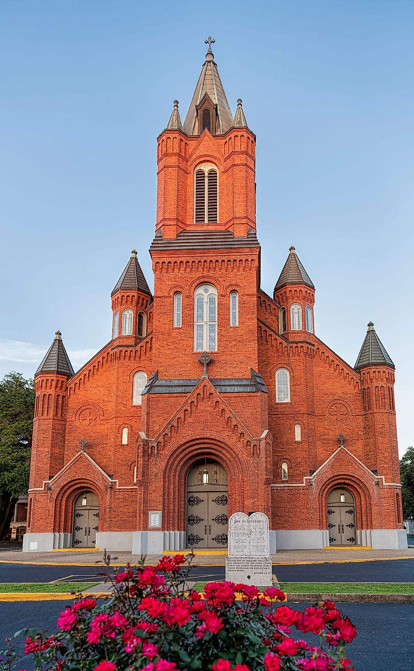 St. Landry Catholic Church With Roses in Foreground in Opelousas Louisiana.