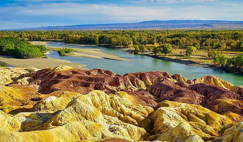 The colorful rocks were formed by wind and water erosion and long-term leaching.Colorful Beach(Rainbow Beach), Burqin Yadan landform, Irtysh River, Xinjiang, China.