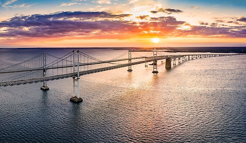 Aerial panorama of Chesapeake Bay Bridge at sunset. The Chesapeake Bay Bridge (known locally as the Bay Bridge) is a major dual-span bridge in the US state of Maryland.
