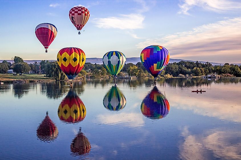 Great Prosser Balloon Rally, Prosser, WA - Hot air balloons over Yakima River.