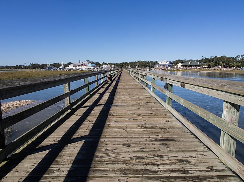 The long wooden pier looking inwards at at Murrell's Inlet, south of Myrtle Beach, South Carolina