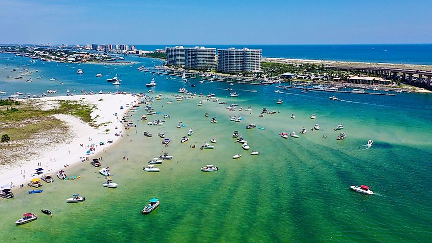 Perdido Pass, Orange Beach, Alabama - A view of the scenic waterway connecting Perdido Bay and the Gulf of Mexico, surrounded by coastal vegetation and boats.