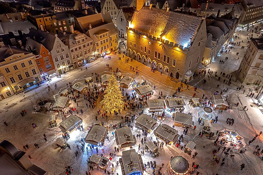 An aerial view of illuminated Tallinn cityscape with Christmas Market in the center in Estonia