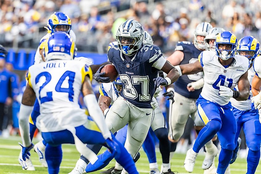 Cowboys running back Phil Mafah #37 runs the ball fighting off pressure from the Rams during an NFL preseason football game at SoFi Stadium Editorial credit: Ringo Chiu / Shutterstock.com
