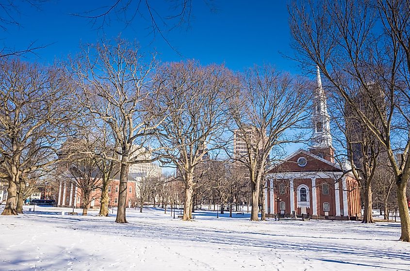 New Haven Green in winter sunlight with snow and blue sky