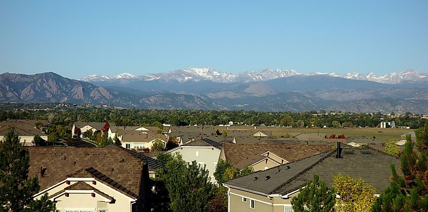 A residential neighborhood in Broomfield, Colorado, with the Front Range in the distance.