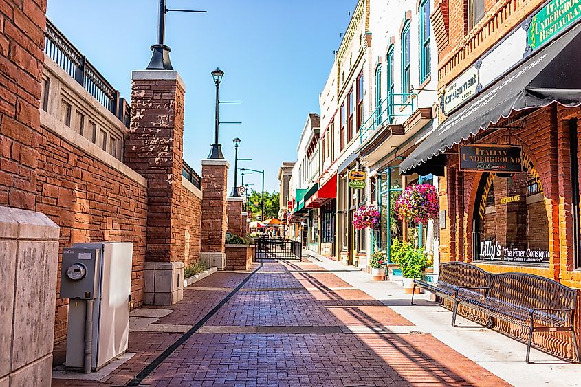 Historic street brick sidewalk in Colorado on Grand Avenue and Italian restaurant, via Kristi Blokhin / Shutterstock.com