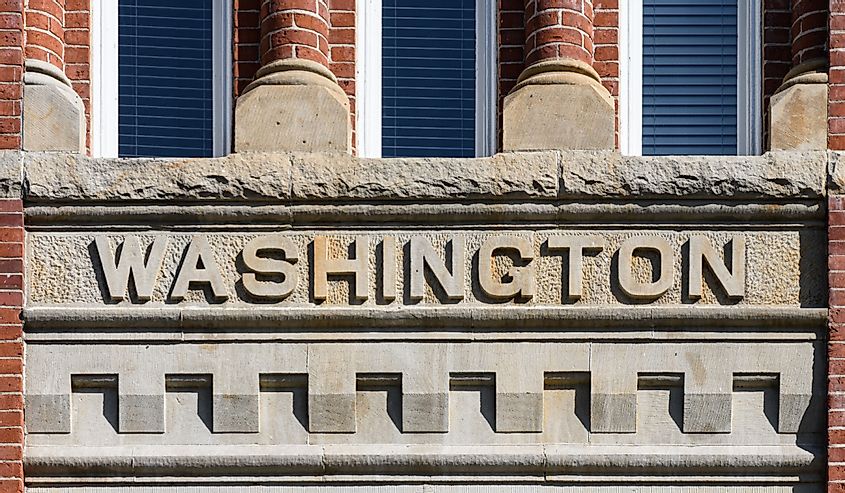 Carved stonework at Central Washington University on Barge Hall of the word Washington. This building was originally the Washington State Normal School