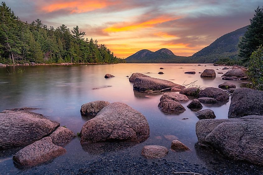 Dawn colors Jordan Pond in Acadia National Park Maine.