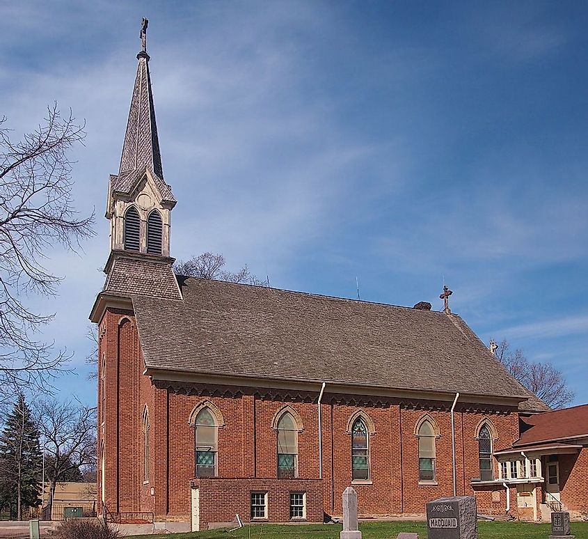 Church of St Hubertus, Chanhassen, Minnesota with a cemetery in front