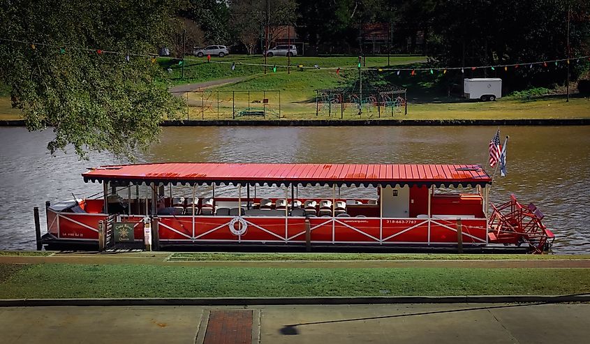 A boat on the Cane River below the town strip