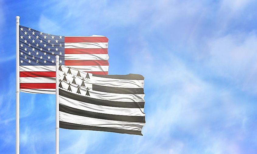 Waving American flag and flag of Brittany.
