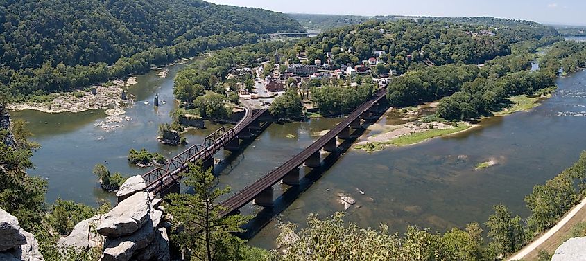 Panoramic view of Harpers Ferry from Maryland Heights, showcasing the Shenandoah River on the left and the Potomac River on the right.