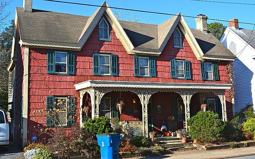 Red home with green bushes out front in the Milton Historic District in Milton, Delaware.