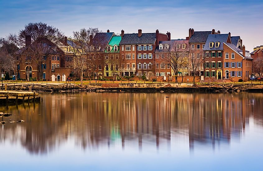 Waterfront buildings reflecting along the Potomac River in Alexandria, Virginia.