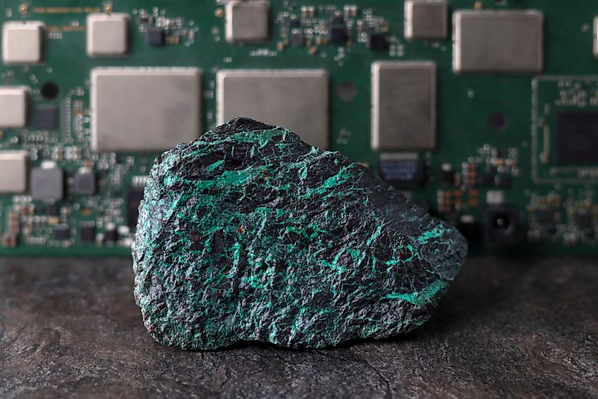 Copper ore, electronic circuit board background. (Credit: BJP7images via Shutterstock)