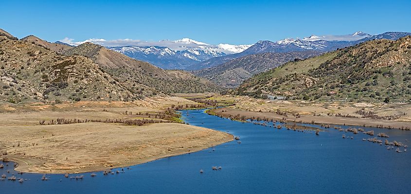 scenic shot of Lake Kaweah with the snowy Sequoia National Park mountains in the background,Three Rivers,California