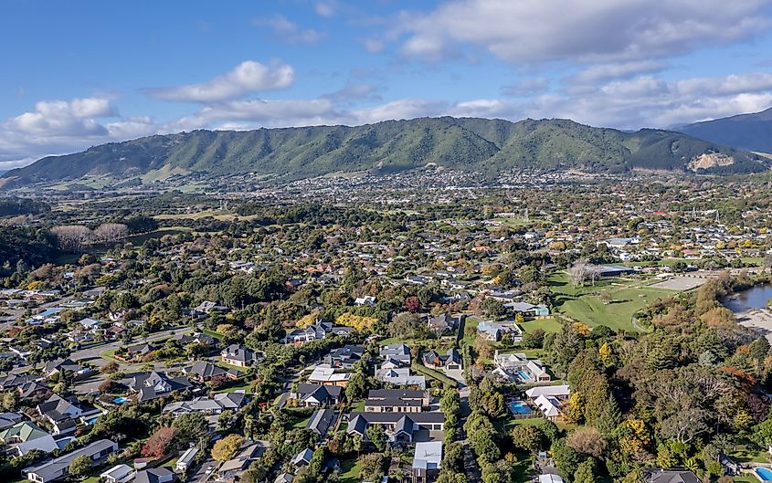 A stunning view of the small town of Waikanae in New Zealand under a beautiful blue sky.