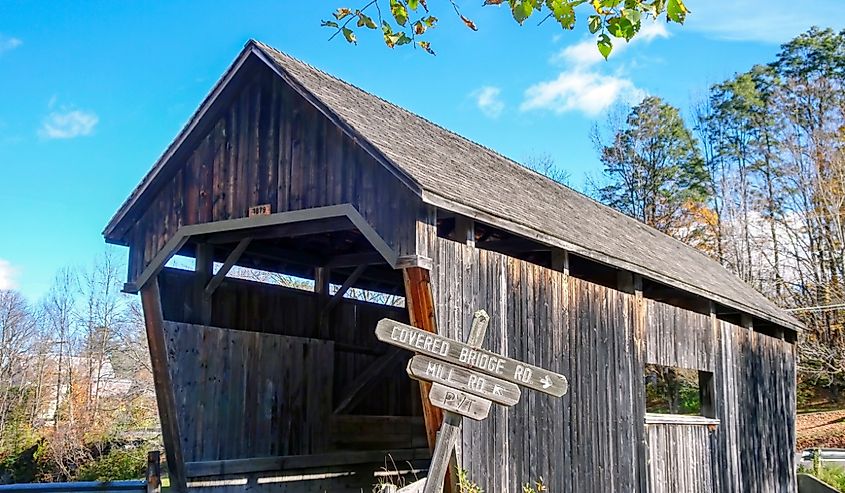 Fall photo in Vermont of the Warren Covered Bridge built in 1879 over the Mad River.