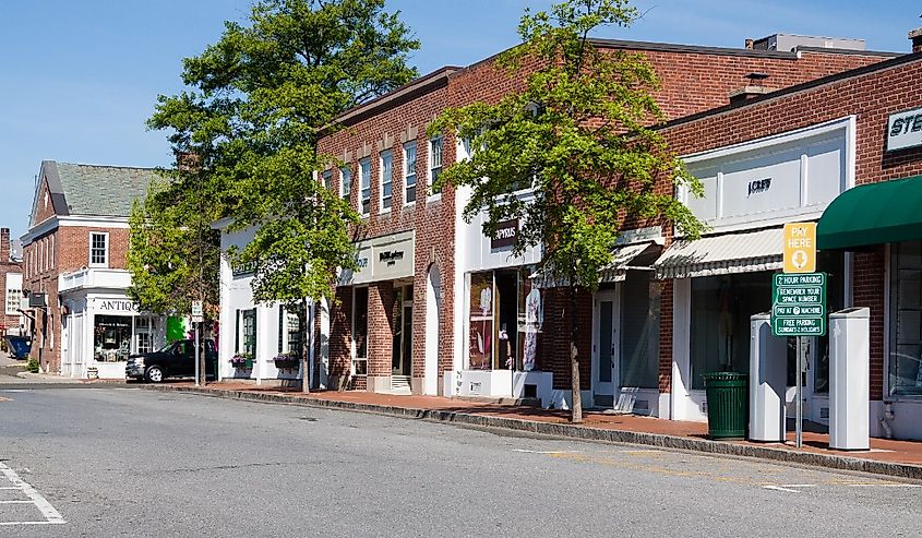 Daytime view of a street in the downtown area of New Canaan, Connecticut during the summer season