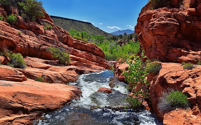 Views of Waterfalls at Gunlock State Park Reservoir Falls, In Gunlock, Utah by St George. Spring run off over desert erosion sandstone. United States.