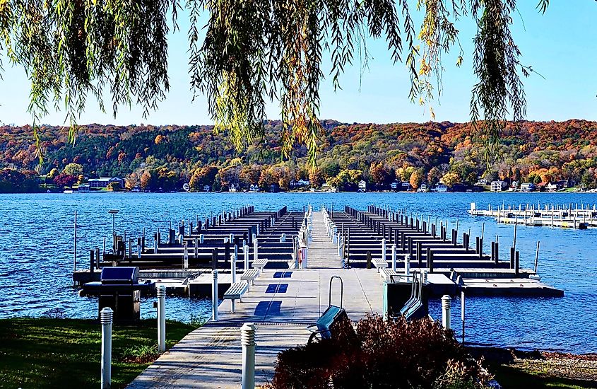 Pier with boat dockage at the marina of Keuka Lake, Penn Yan, New York. Autumn landscape scene. Finger Lakes region.
