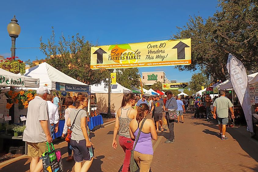 Vendors and shoppers at the Sarasota Farmers Market in Sarasota, Florida