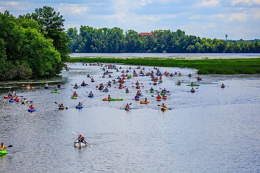 Kayakers coming around the corner at the 4th Annual Paddle Pub Crawl, Wausau, Wisconsin