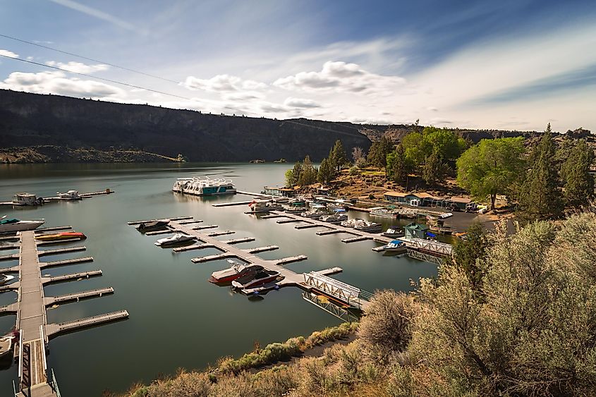 Culver, Oregon, USA - May 15th, 2020: Beautiful marina of the Cove Palisades State park on Billy Chinook Lake in sunny day, via Victoria Ditkovsky / Shutterstock.com