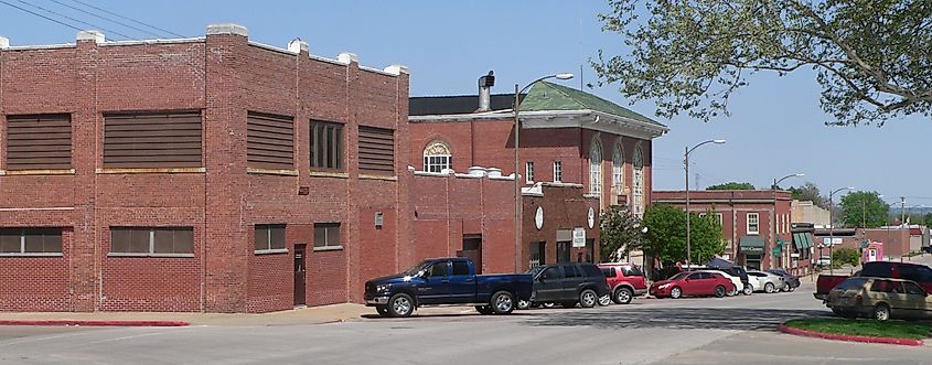 North side of 1st Corso, looking northeast from 9th Street, in Nebraska City, Nebraska. The two-story green-roofed building with arched windows at center is the Memorial Building.