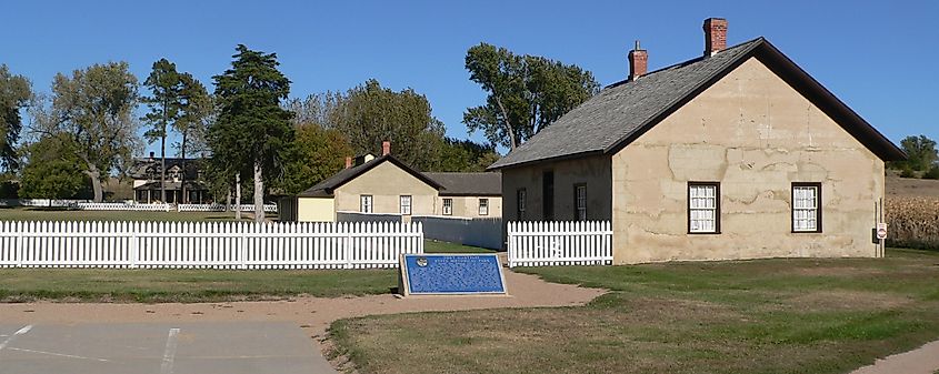 Fort Hartsuff, located north-northwest of Elyria in rural Valley County, Nebraska. Southeast side of parade ground. In the right foreground is the post headquarters. Behind and to the left of that is the barracks. Behind and to the right of that is officer's quarters.