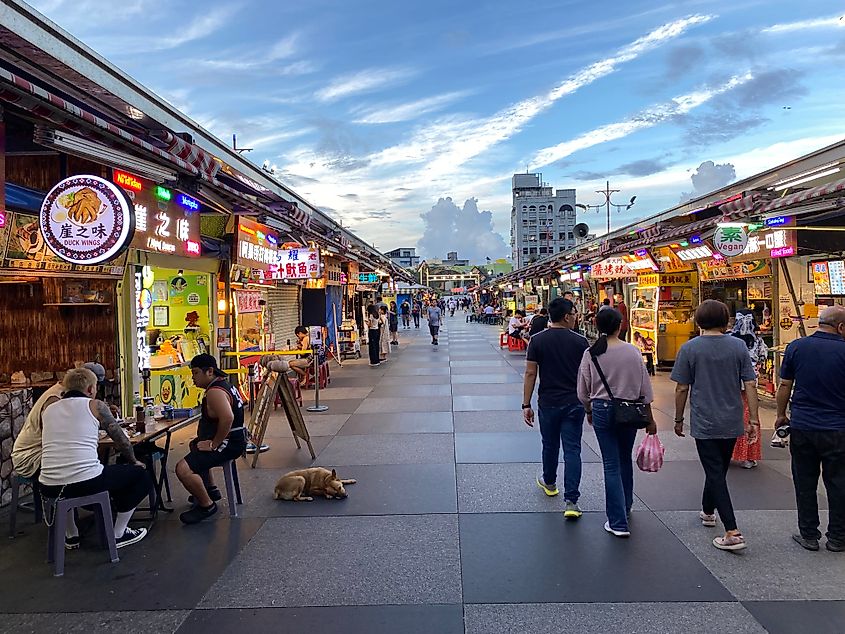 A clean and moderately crowded Asian night market.