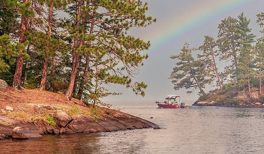 People are enjoying fishing and boating under sunset on Crane Lake, Voyageurs National Park, Minnesota