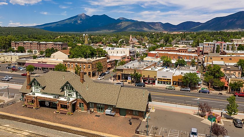Traffic makes it's way past the train station along route 66 in Flagstaff, Arizona USA 2019