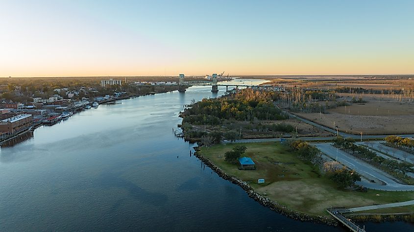 Sunrise over Cape Fear River with the Cape Fear Memorial Bridge in the background and downtown Wilmington, North Carolina to the left