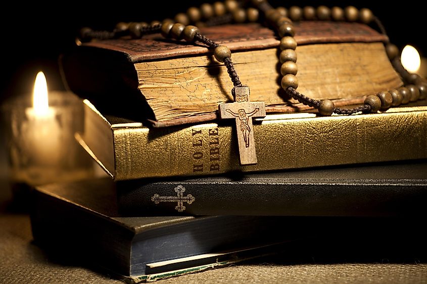Old Holy Bibles, Rosary Beads and Candles