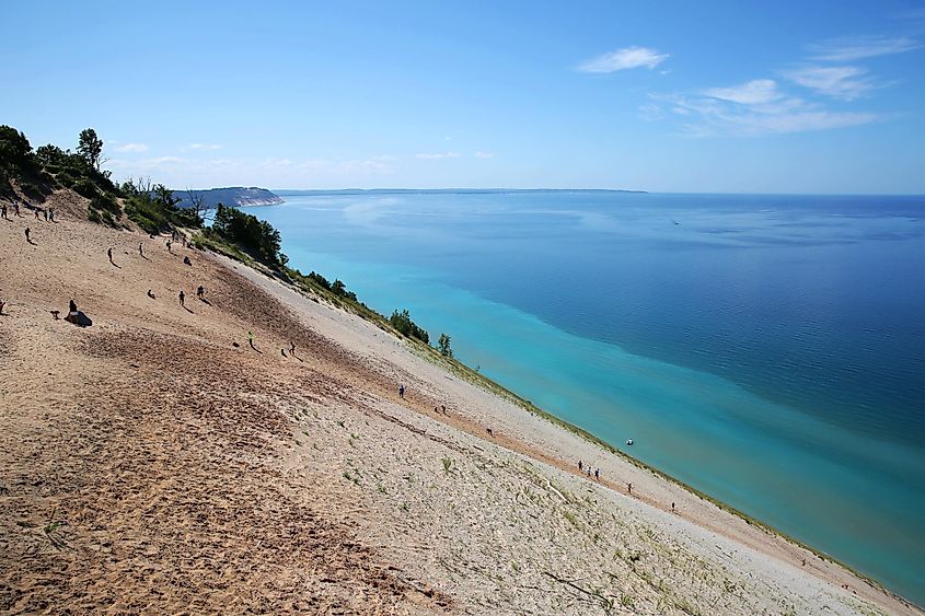 Tourists climbing steep sand dunes at Sleeping Bear Dunes National Lakeshore, Michigan