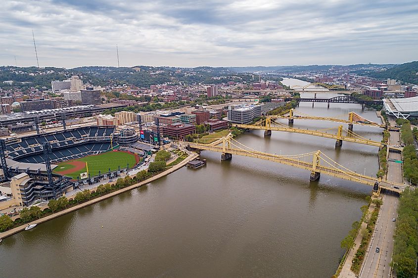 The three identical yellow Three Sisters bridges crossing the Allegheny River in Pittsburgh. Editorial credit: photosounds / Shutterstock.com