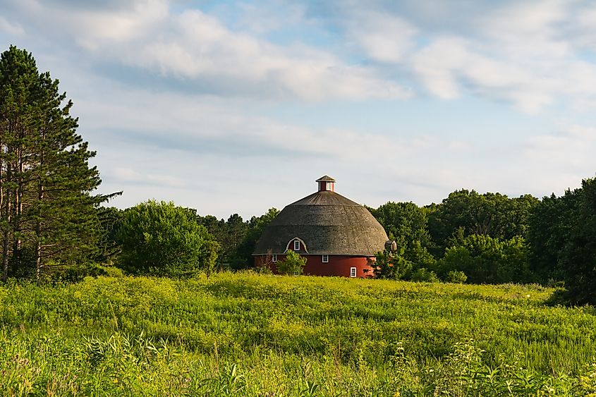 Round red barn with meadow and beautiful skies. Kewanee, Illinois, USA