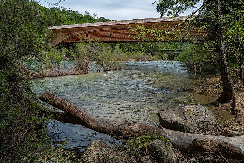 Side view of the bridgeport Covered Bridge at South Yuba River in California, USA. This bridge has the longest clear span of any surviving covered bridge in the world