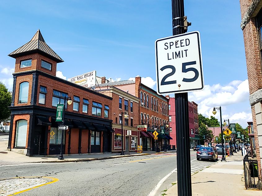 Entrance to the historic downtown Woonsocket, Rhode Island, featuring a 25 mph speed limit sign.