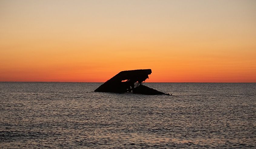 The sunken ship of Cape May sitting in the ocean.