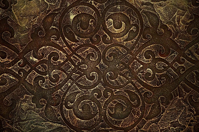 Old Celtic pattern texture on stone with moss