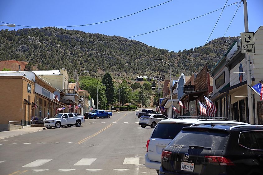 Pioche, Nevada, main street with American flags near stores. 