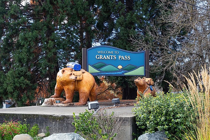 Editorial Photo Credit: Victoria Ditkovsky via Shutterstock. Grants Pass, Oregon, USA - November 23rd, 2023: Welcome to Grants Pass sign decorated with  figures of bears