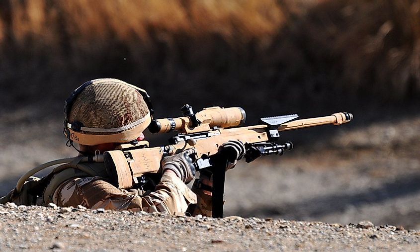 A sniper aiming a L115A3 rifle